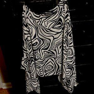 Black and white swirls shirt! Kind of crop in the front! Arms are flowy!